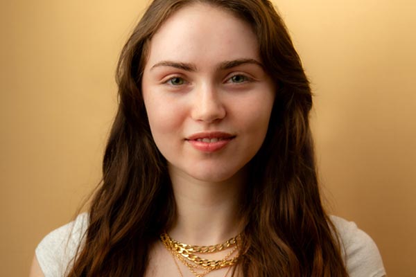 Before image of a model not wearing any makeup or Cotz products