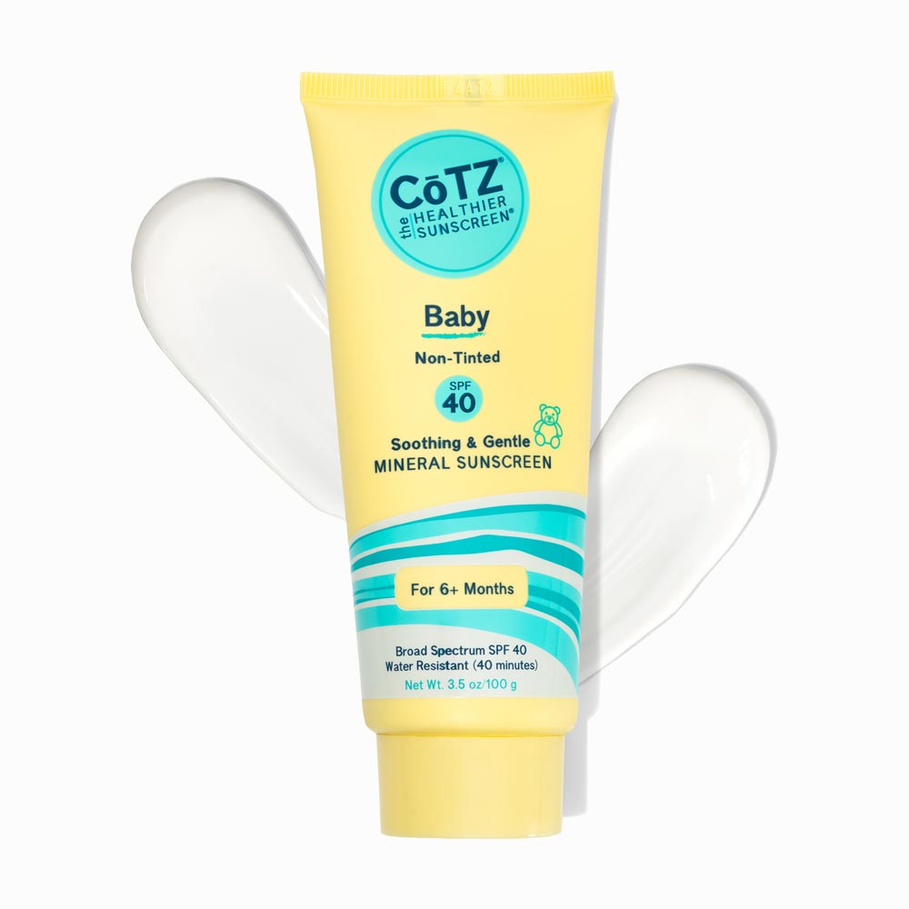 Image of Cotz Baby Non-Tinted SPF 40 tube with two swatches behind the tube on a white background