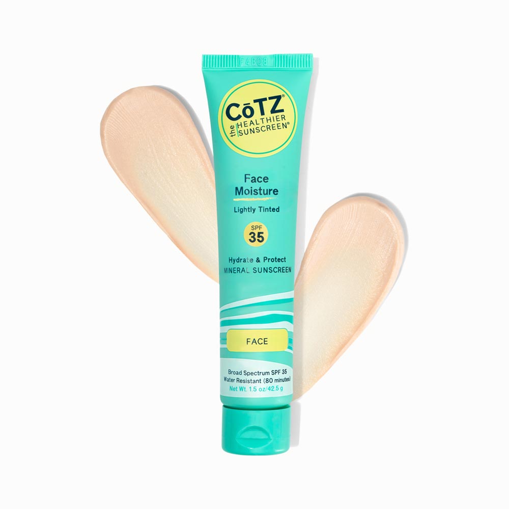 Image of Cotz Face Moisture Lightly Tinted SPF 35 tube with two swatches behind it on white background