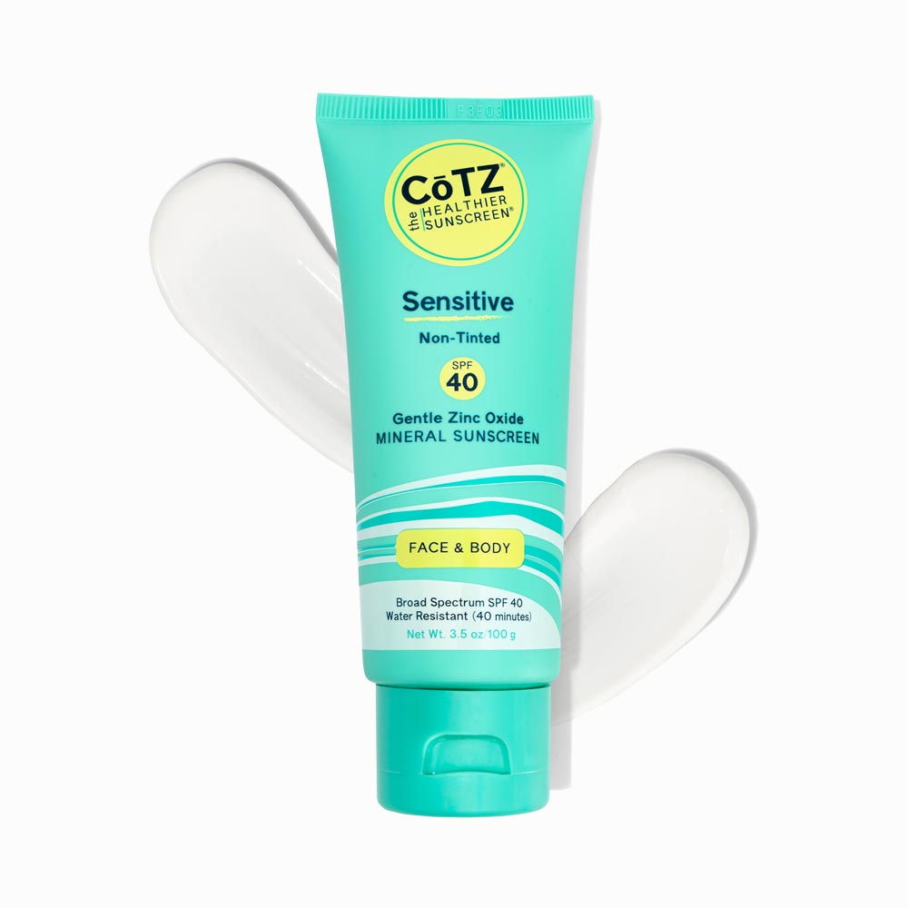 Cotz Sensitive Non-Tinted SPF 40 tube with two swatches behind it on white background