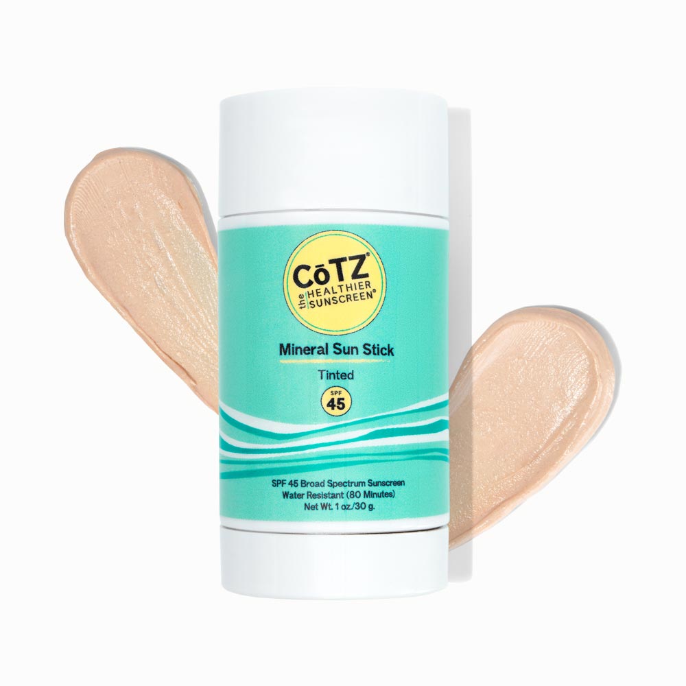 Cotz Mineral Sun Stick Tinted SPF 45 tube with two swatches behind it on white background