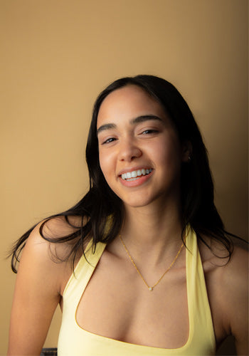 Image of model smiling with a fresh face of Cotz Face Moisture SPF 35 applied